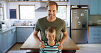 Portrait, father and child with smile in kitchen for funny joke, playful family and bonding together. Happy, man and boy with love, affection and parent support with care for weekend break at house