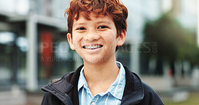 Buy stock photo Outdoor, school and boy with smile in portrait, education and studying opportunity with happiness. Campus, male child and student with with confidence for elementary, learning academy and braces