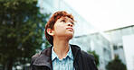 Outdoor, school and boy with walking for thinking, education and studying opportunity with backpack. Campus, male child and student with thoughts for elementary, learning academy and learner