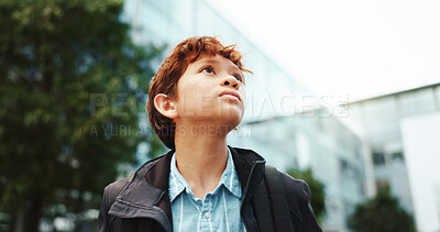 Buy stock photo Outdoor, student and boy in school for thinking, education and studying opportunity with idea. Low angle, male child and learner with thoughts for elementary, learning academy and kid on campus