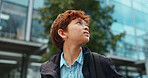 Outdoor, boy and student with backpack for school, education and studying opportunity with thinking. Campus, male child and walking with thoughts for elementary, learning academy and learner outside