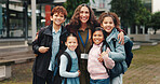 Children, hug and happy with teacher, outdoor and reunion in city for solidarity, connection or portrait. School kids, group and woman with embrace, education and welcome for scholarship at academy
