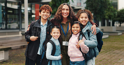 Buy stock photo Children, hug and happy with teacher, outdoor and reunion in city for solidarity, connection or portrait. School kids, group and woman with embrace, education and welcome for scholarship at academy