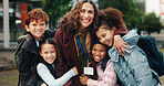 Children, hug and smile with teacher, academy and support in city for solidarity, connection or portrait. School kids, group and woman with embrace, education and outdoor for reunion with scholarship