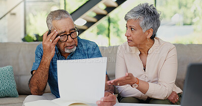 Buy stock photo Stress, documents and senior couple on sofa in discussion for debt, mortgage or bills repayment. Argument, upset and elderly man with woman for conversation on retirement funds with paperwork in home