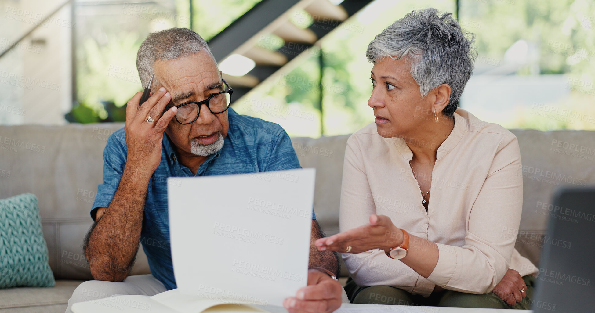 Buy stock photo Stress, documents and senior couple on sofa in discussion for debt, mortgage or bills repayment. Argument, upset and elderly man with woman for conversation on retirement funds with paperwork in home