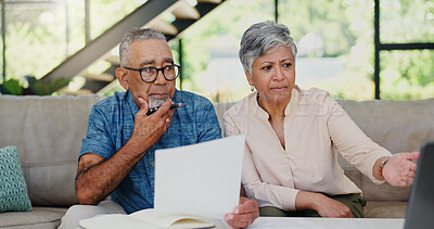 Buy stock photo Stress, paperwork and senior couple on sofa in discussion for debt, mortgage or bills repayment. Argument, upset and elderly man with woman for conversation on retirement funds with documents in home