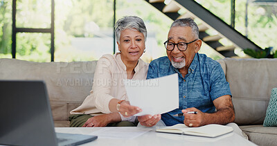 Buy stock photo Smile, documents and senior couple on sofa in discussion for debt, mortgage or bills payment completed. Excited, investment and elderly man with woman for retirement funds plan with paperwork in home
