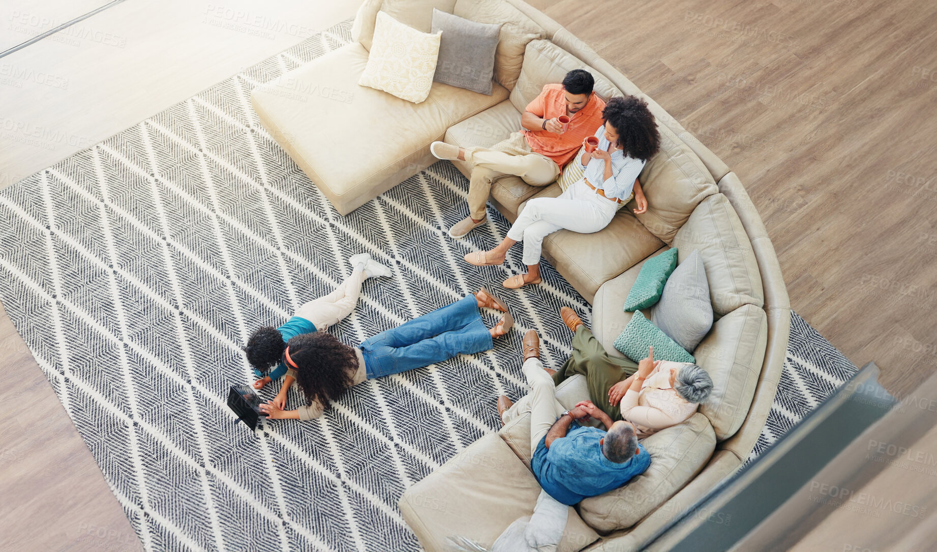 Buy stock photo Bonding, relax and streaming with family on sofa in living room of home together from above. Coffee, conversation or visit with children, parents and grandparents in apartment for break or holiday