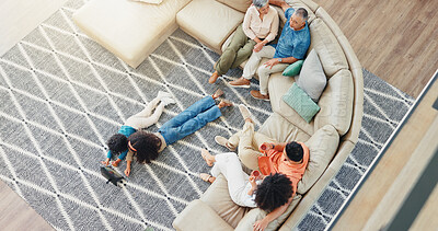 Buy stock photo Relax, streaming and visit with family on sofa in living room of home together from above. Bonding, coffee or conversation with children, parents and grandparents in apartment for break or holiday