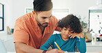 Writing, help and father with child in house for homework, studying or assignment for school. Education, growth and dad with boy kid for family support with test or exam in apartment together.