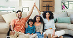 Parents, children and home with roof sign, floor and smile in portrait with security, protection and support. Father, mother and kids with gesture, icon and happy in lounge at family house in Brazil