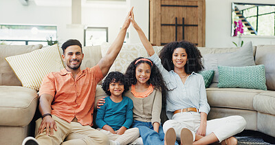 Buy stock photo Parents, children and home with roof sign, floor and smile in portrait with security, protection and support. Father, mother and kids with gesture, icon and happy in lounge at family house in Brazil