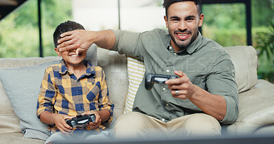 Buy stock photo Boy, father and cover eyes with video game on sofa, controller and contest with bonding, love and playful. People, dad and child with console for challenge, competition and cheating in family house