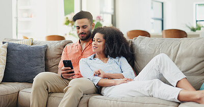 Buy stock photo Love, phone and relax with couple on sofa in living room of home together for communication. App, break or social media with man and woman in apartment for bonding, browsing or online shopping