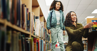 Buy stock photo Girl, woman and search for book at library by shelf with smile for learning, help and education. People, child and librarian with guide, language and literature for development, story and scholarship