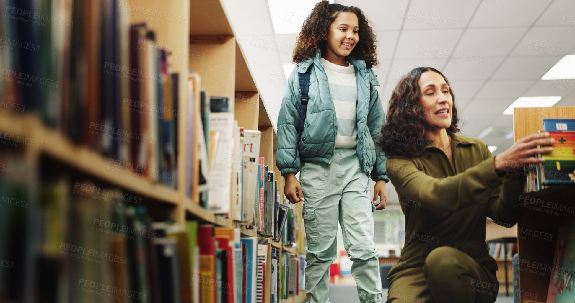 Buy stock photo Girl, woman and search for book at library by shelf with smile for learning, help and education. People, child and librarian with guide, language and literature for development, story and scholarship