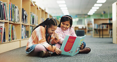 Buy stock photo Girl, together and happy with book at library for development, learning and study on floor. School kids, storytelling and excited with scholarship, education and language with reading at academy