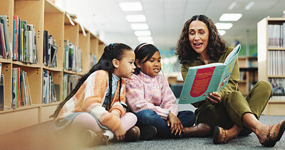 Buy stock photo Girl, teacher and book with reading at library for development, learning or study with guide. School kids, storytelling and woman with help on floor, education and language for knowledge at academy