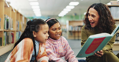 Buy stock photo Children, teacher and education with reading book at library for development, learning or study with guide. School kids, storytelling and woman with help, excited or language for knowledge at academy