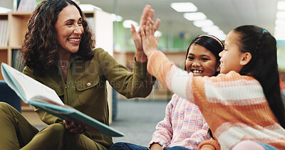 Buy stock photo School kids, teacher and high five with book at library for achievement, learning and celebration for progress. Children, reading and story with woman for goals, excited or cheers language at academy