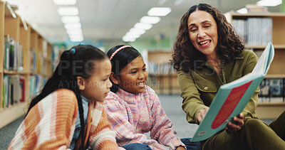 Buy stock photo School kids, teacher and education with book at library for development, learning or study with guide. Children, reading and storytelling with woman for help, excited or teaching language at academy