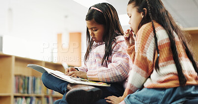 Buy stock photo Girl, together and reading with story at library for development, learning and study with literature. School kids, book and help with scholarship, education and language with knowledge at academy