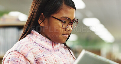 Buy stock photo Education, learning and kid reading book in library for skill, knowledge and concentrate at school. Child, girl and student study textbook to research for project, development or language improvement