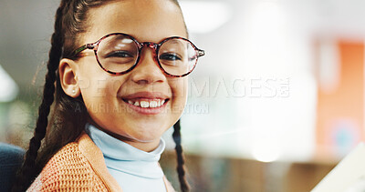 Buy stock photo Portrait, kid and girl in library, glasses and smile with confidence, optometry and education. Face, student and child development with eyewear, clear vision and pride with knowledge or future growth
