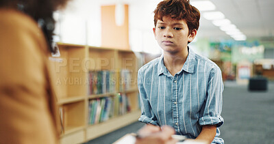 Buy stock photo Counseling, listening or writing with child and therapist in library of school for assessment or review. Development, feedback and occupational therapy with student speaking to counselor for support