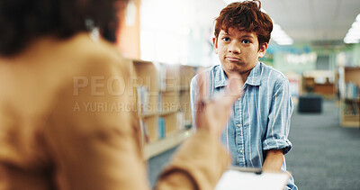 Buy stock photo Counseling, hand or question with child and therapist in library of school for assessment or review. Consulting, feedback and occupational therapy with student speaking to counselor for support