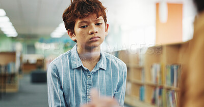 Buy stock photo Children, counseling or listening with boy and therapist in library of school for assessment or review. Development, education and occupational therapy with student speaking to counselor for support