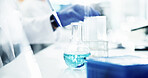 Person, scientist or beaker with chemical for science research, discovery or exam at laboratory. Closeup, medical testing or glass with liquid compound for new medicine, cure or clinical trial at lab