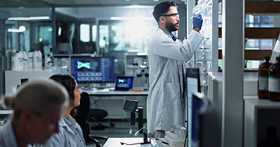 Buy stock photo Glass wall, science and writing with people in laboratory for equation, formula or solution. Healthcare, innovation and medical with scientist at work on clinical trial for pharmaceutical development