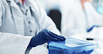 Hands, scientist and gloves with sample box for blood vial, dna test and medical discovery of vaccine. Closeup, person and research with gene particles for investigation, healthcare solution and lab