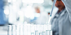 Person, scientist and tubes with pipette for medical research, clinic trial or chemical testing at lab. Closeup, science or chemistry with samples for new medicine, discovery or results at laboratory