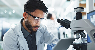 Buy stock photo Tablet, man and scientist with microscope in laboratory for online research with DNA for medical innovation. Biotechnology, goggles and male biologist with RNA for pharmaceutical study or discovery.