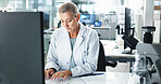 Woman, scientist and typing with research on computer for medical results or discovery at laboratory. Female person, science or healthcare worker with technology for scientific report or analysis