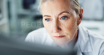 Buy stock photo Thinking, scientist and woman with computer, lab and serious for research on web, reading and info. Healthcare, medical professional and mature person with tech for science, review and digital record