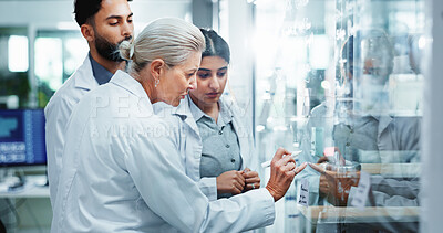 Buy stock photo Glass wall, science and people in lab, research and collaboration for experiment. Scientist, group and employees in workplace, cooperation and review chemistry equation with brainstorming and results