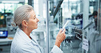 Woman, scientist and thinking with glass board for equation, problem solving or drug trial at lab. Female person, doctor or analysis with chemical formulation, molecule development or clinic results