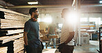 Collaboration, industry and talking with carpenter men in workshop for manufacturing or production. Carpentry, planning and teamwork with woodworking people in factory together for conversation