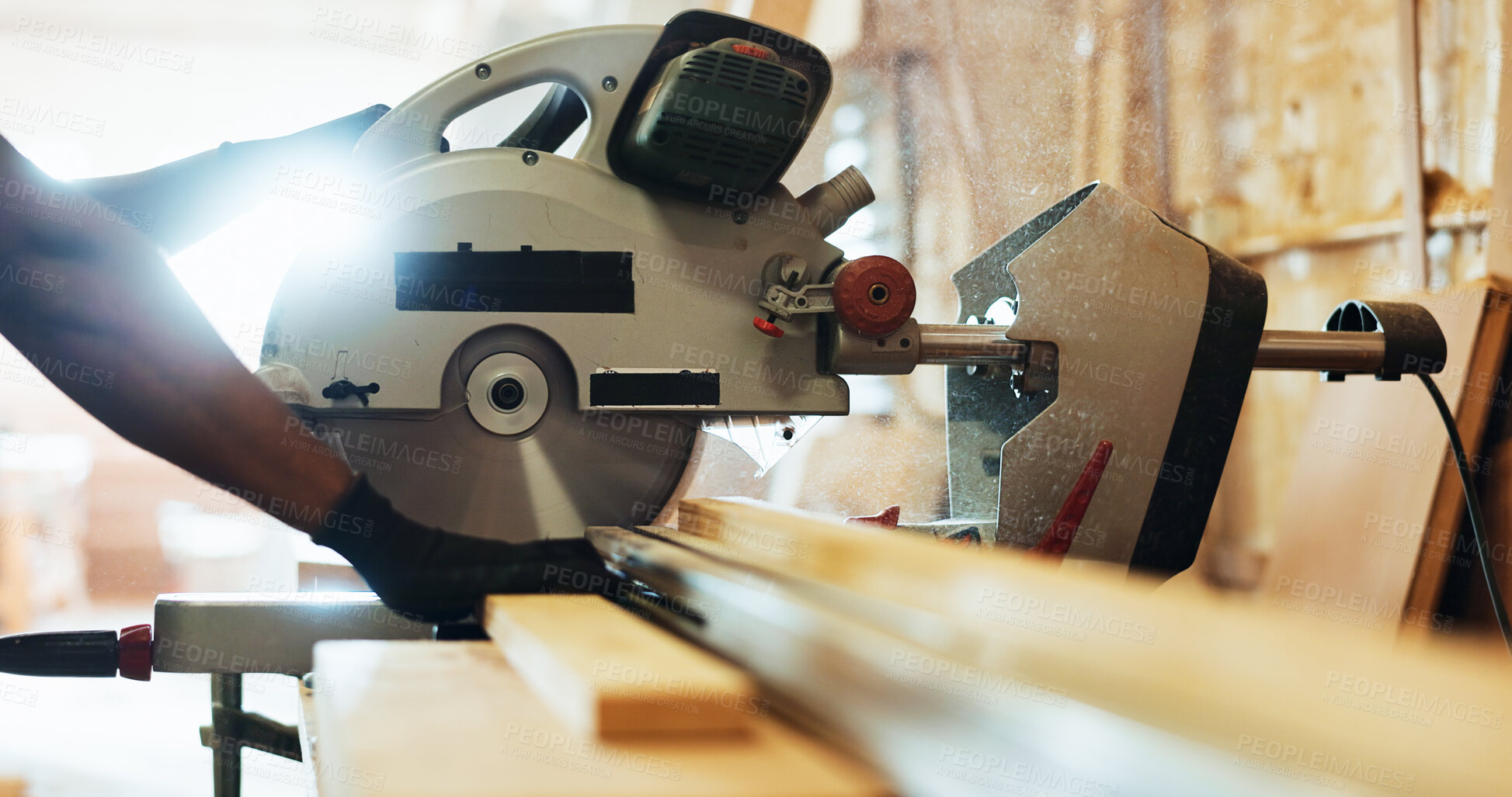 Buy stock photo Workshop, hands and machine with wood for carpenter, diy manufacturing or production business. Closeup, person and contractor with saw tools for furniture service, maintenance or cut plank in factory