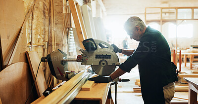 Buy stock photo Factory, man and machine with wood for carpenter, diy manufacturing and production business. Workshop, mature person and contractor with saw tools for furniture service, maintenance and cutting plank