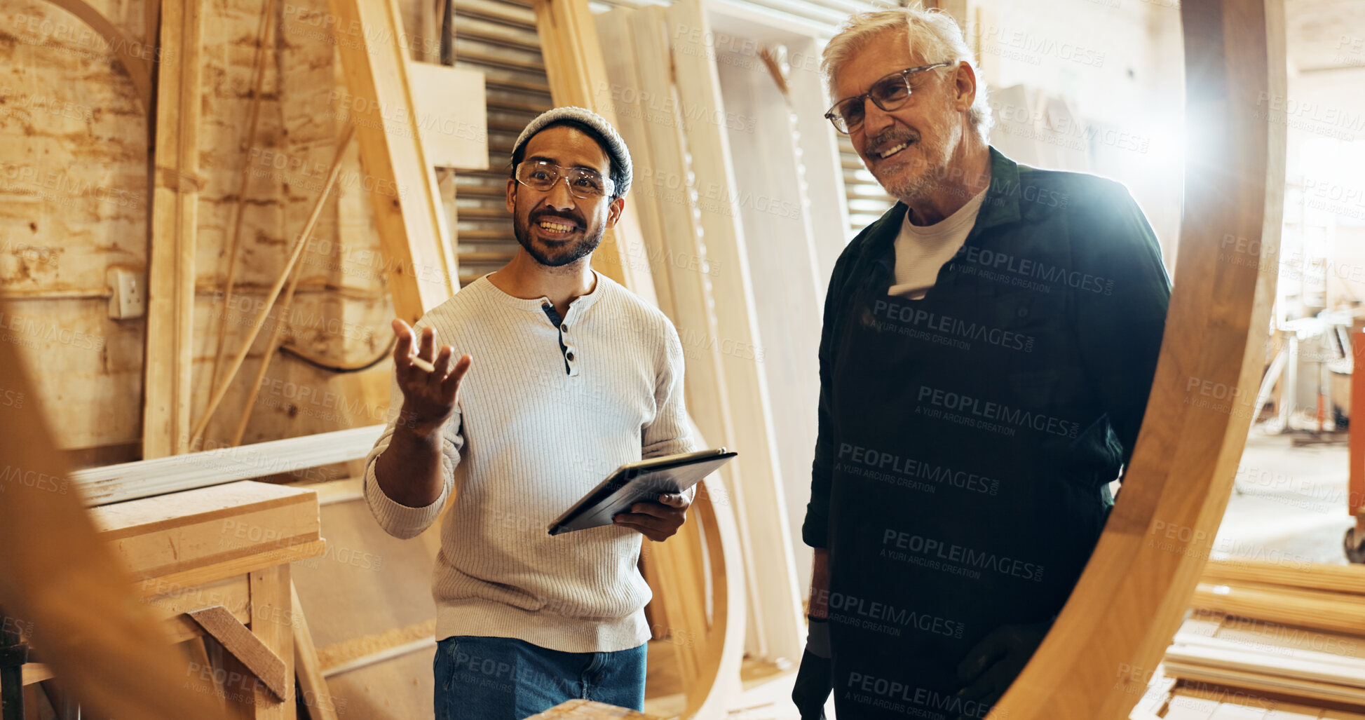 Buy stock photo Carpenter team, man and tablet in workshop for woodwork project inspection, checking framework or monitor process. Manufacturing, people and happy with structure evaluation and furniture production