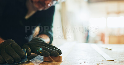 Buy stock photo Carpenter, woodworking and man with sandpaper, hands and smoothing surface with tool or manufacturing. Production, artisan and person with gloves for safety, grip and shaping of material in business
