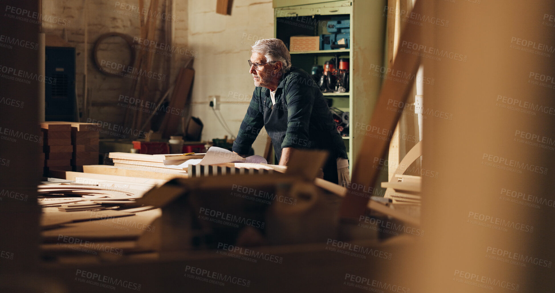 Buy stock photo Carpenter, thinking and man in shop, manufacturing and ideas for woodworking in business and table. Construction, entrepreneur and mature person with material for furniture, contemplating and serious