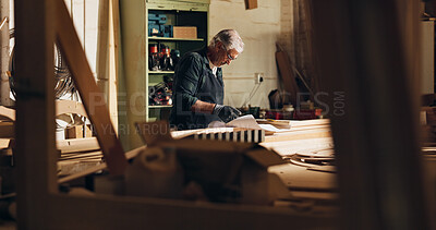 Buy stock photo Carpenter, thinking and man with blueprint, woodworking and ideas for manufacturing, table and business. Construction, entrepreneur and mature person with material for furniture and floor plan