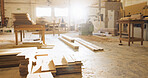 Timber, wood and carpentry in empty workshop for furniture manufacturing, renovation and labor. Materials, plank and crafting production with woodwork, remodeling maintenance and restoration industry