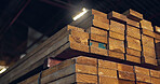 Stack, wood and carpentry in empty workshop for furniture manufacturing, renovation and storage. Lumber, material and crafting production for woodwork, remodeling maintenance and restoration industry